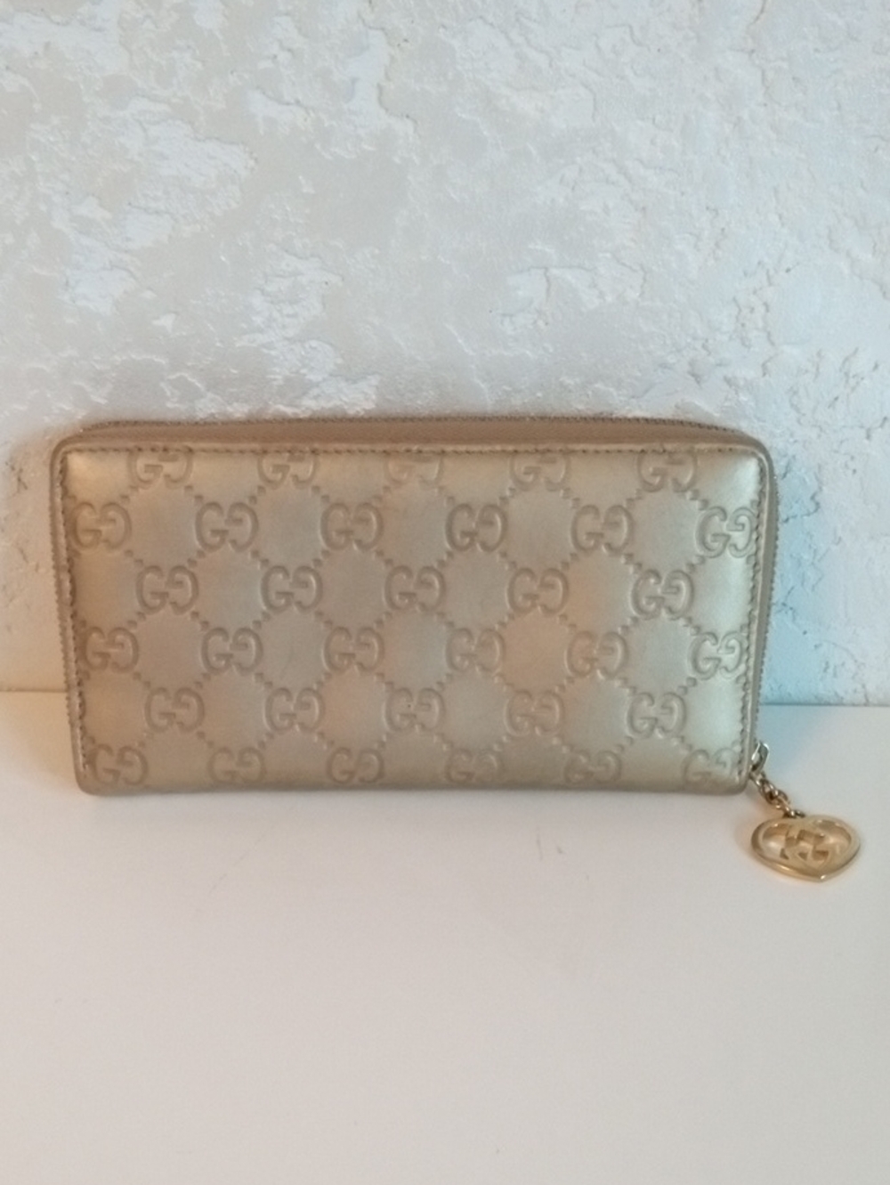 Gucci Gold Embossed GG Zip-Around Wallet 38